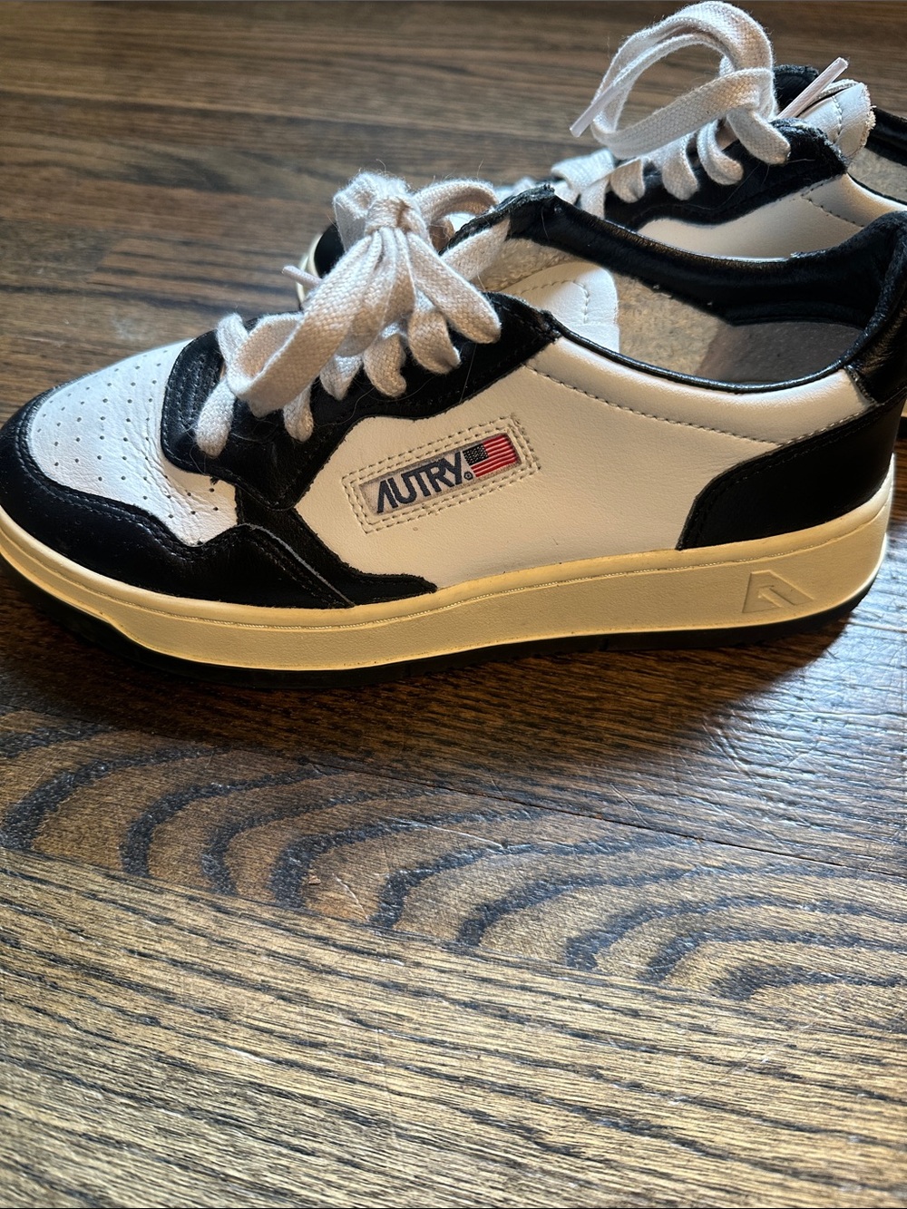 Autry Low-Top Leather Sneakers in White and Black